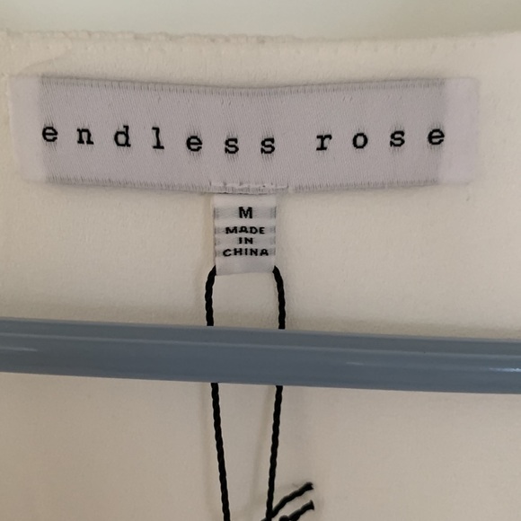 White jumper shorts one piece. Endless rose from Revolve. Never warn with tags. - Picture 4 of 4